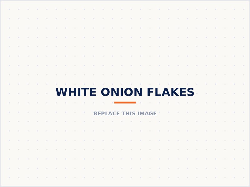 White onion flakes in a wooden bowl beside a whole white onion